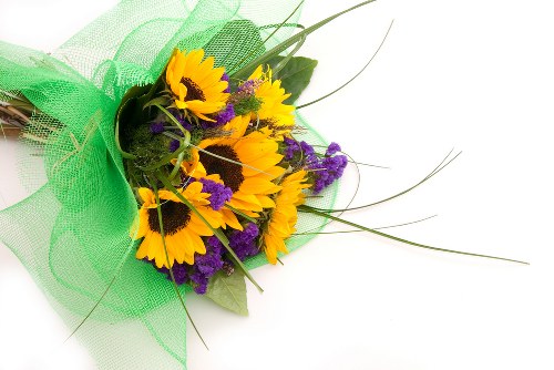 Florist arranging a colorful flower bouquet for delivery